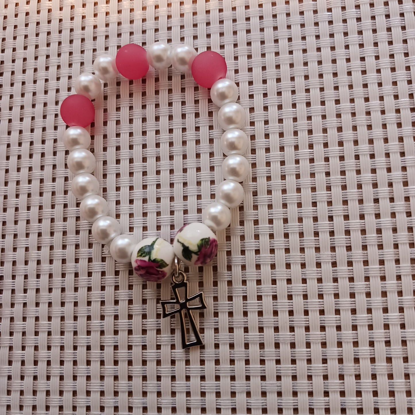 White pearl with pink beads and cross charm