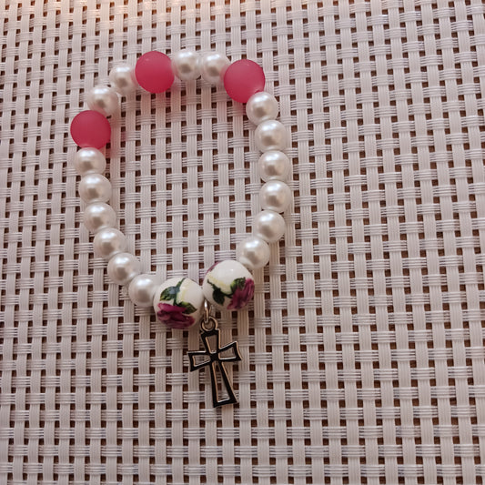 White pearl with pink beads and cross charm